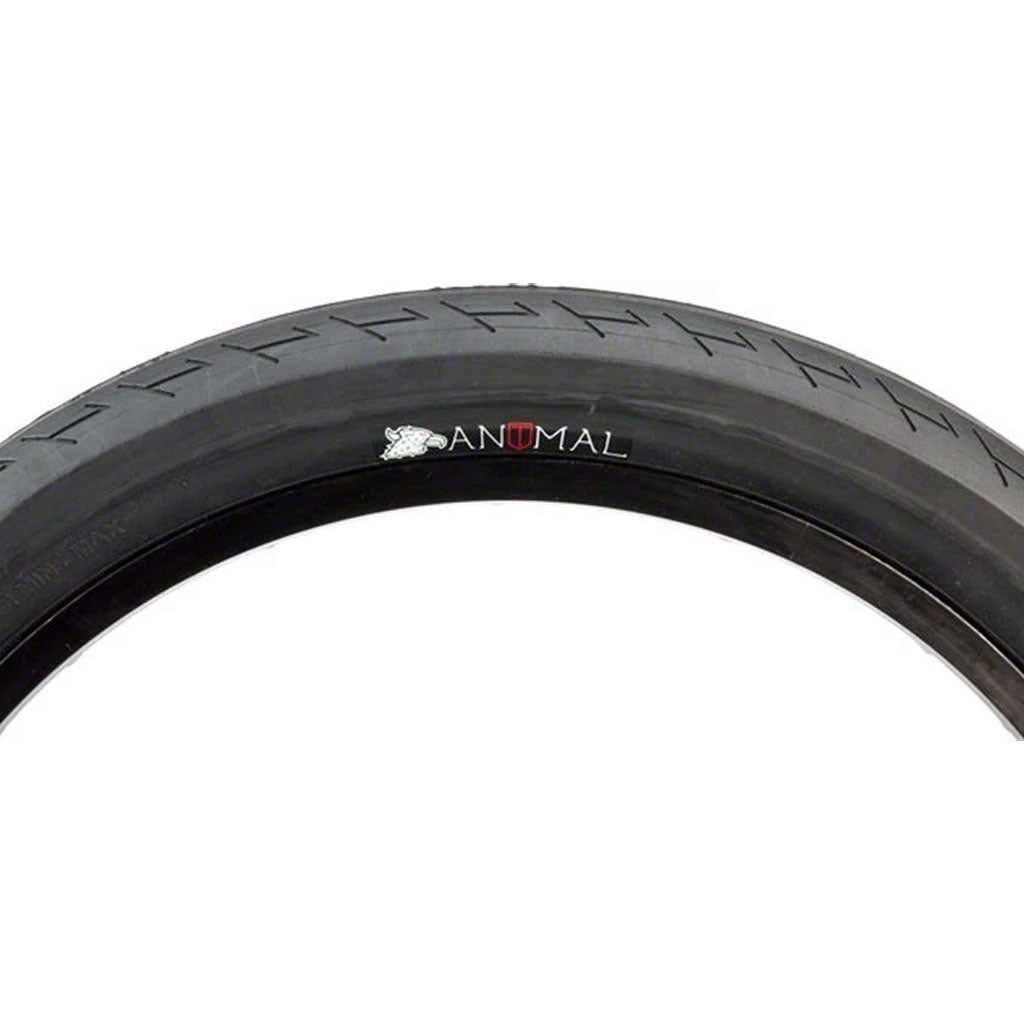 A close-up of an Animal X Terrible One Ursa Tyre (Each) showcases the word "ANIMAL" printed boldly on the side, highlighting its dual compound tread for enhanced durability and performance.