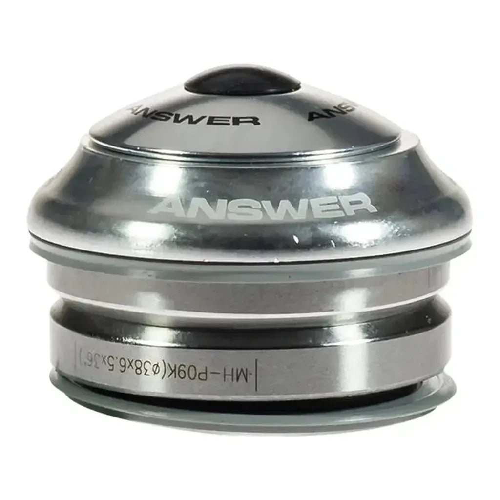 The Answer Mini Integrated 1in IS38 Headset features a silver 1-inch design with "ANSWER" branding, a rounded aluminum dust cover, multiple stacked metal parts, and sealed cartridge bearings for smooth, durable rotation.