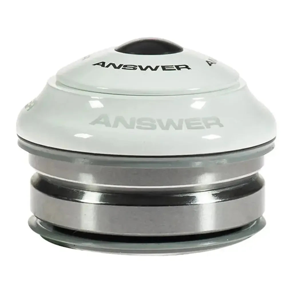 The Answer Mini Integrated 1in IS38 Headset features a white and silver finish, "ANSWER" on the top cap, smooth rounded design, and sealed cartridge bearings for durability.