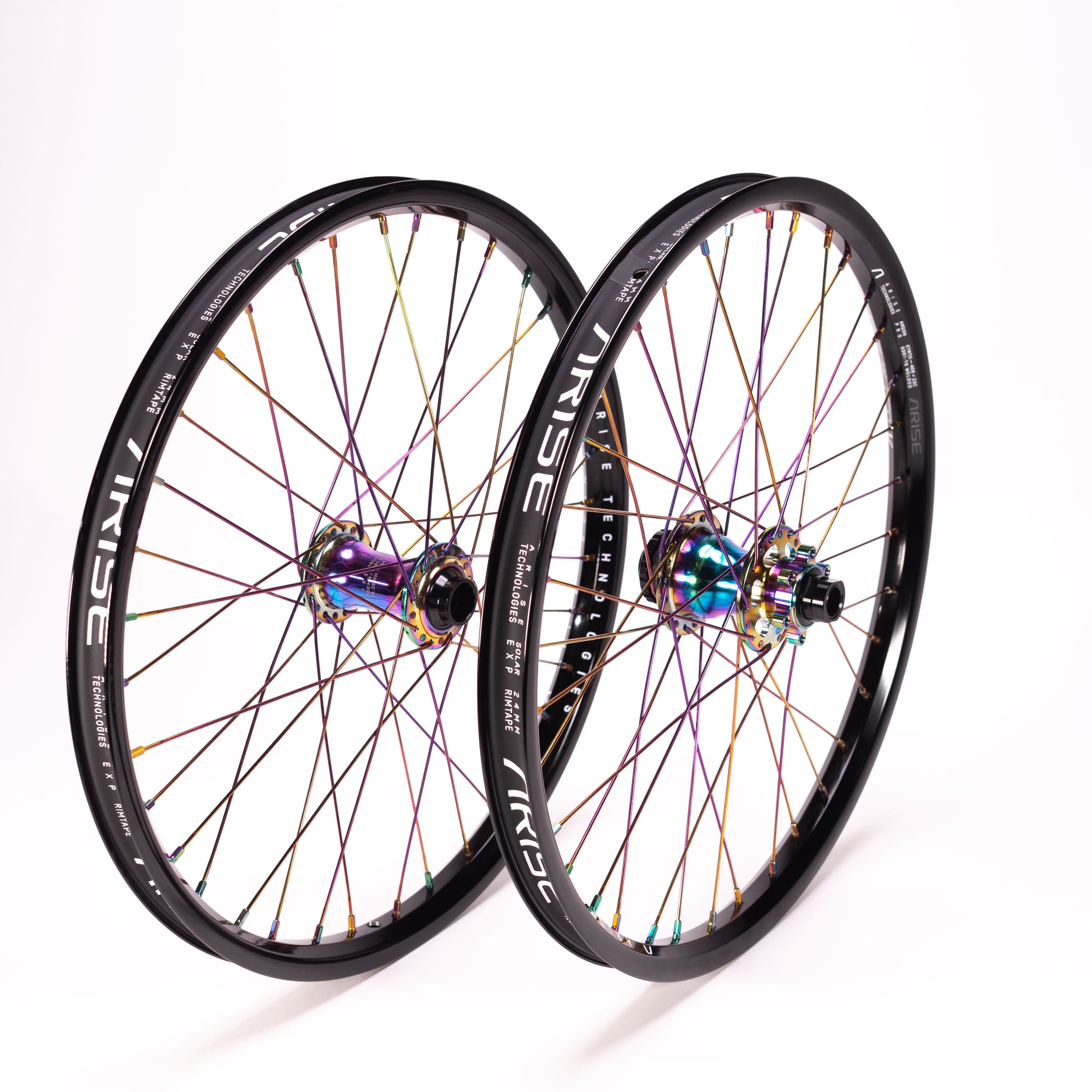 The Arise Echo Oilslick Pro 20 Inch Wheelset, with its iridescent spokes and black tubeless-ready rims, stands upright against a plain white background, capturing attention.