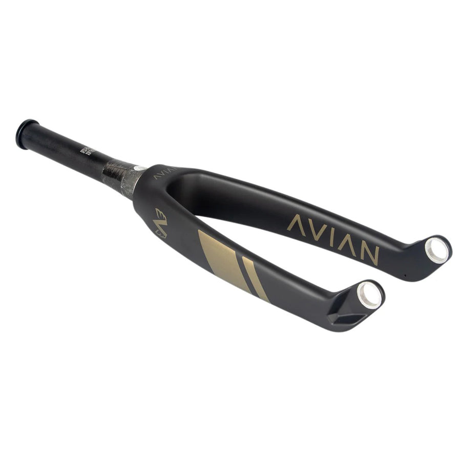 The Avian Versus Pro 20 Inch 20mm Tapered Carbon Fork, featuring a sleek black design with gold lettering on a pristine white background, is ideal for BMX racing frames and showcases the finest engineering from AVIAN.