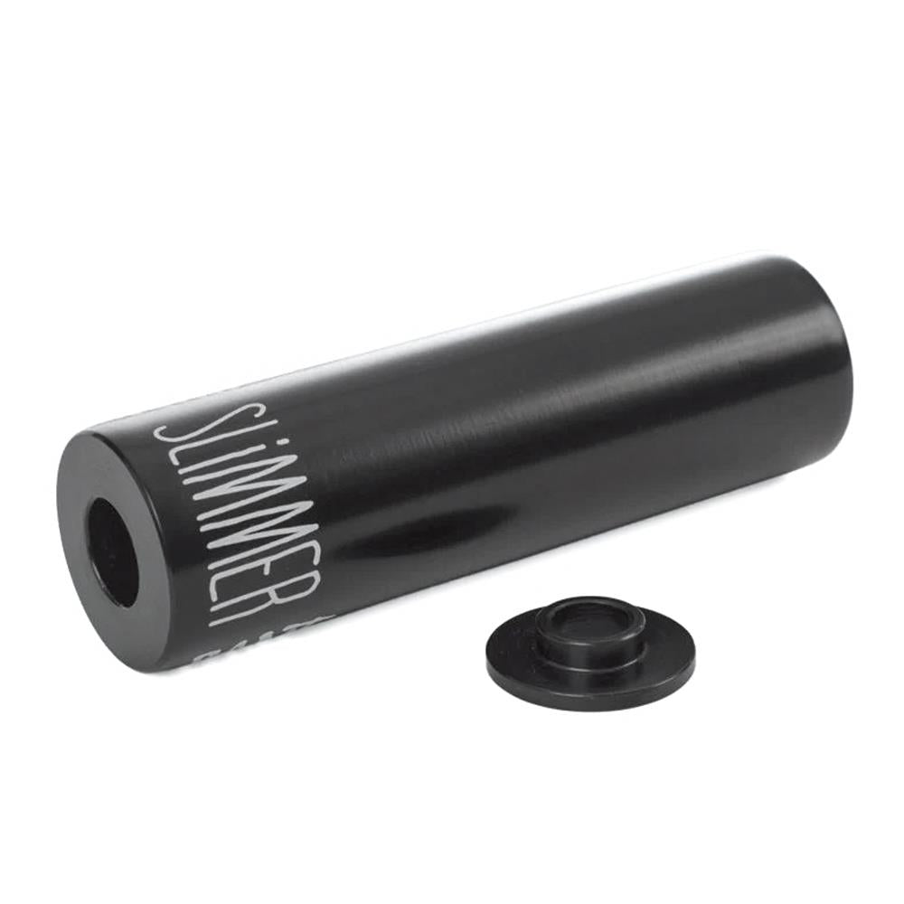 The Rant Slimmer Peg (Each) is a black cylindrical steel peg with "SLIMMER" printed on it, shown with a matching spacer—ideal as lightweight bike or BMX pegs for your setup.