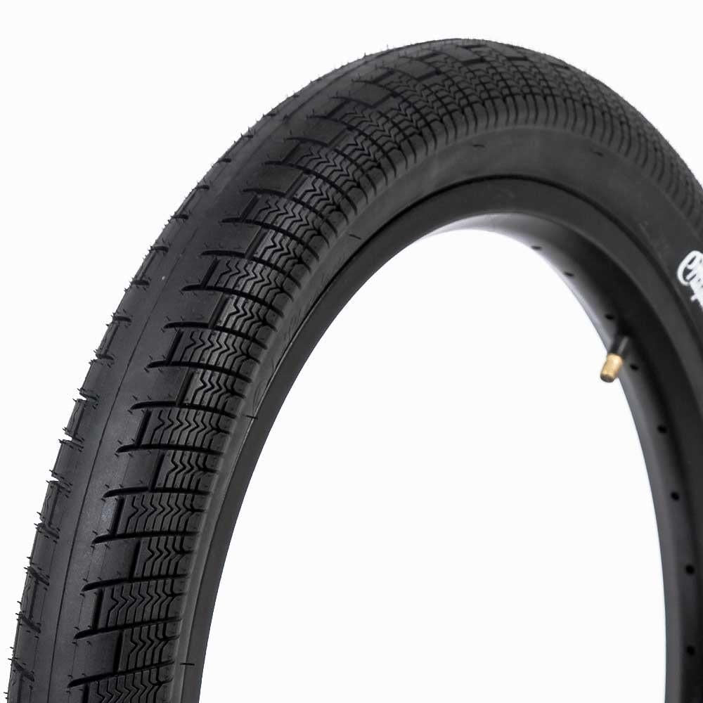 A close-up of the Shadow Creeper 20 Inch Tyre in black, featuring a textured tread, high PSI rating, and visible valve stem—ideal for riders looking for a performance tire.