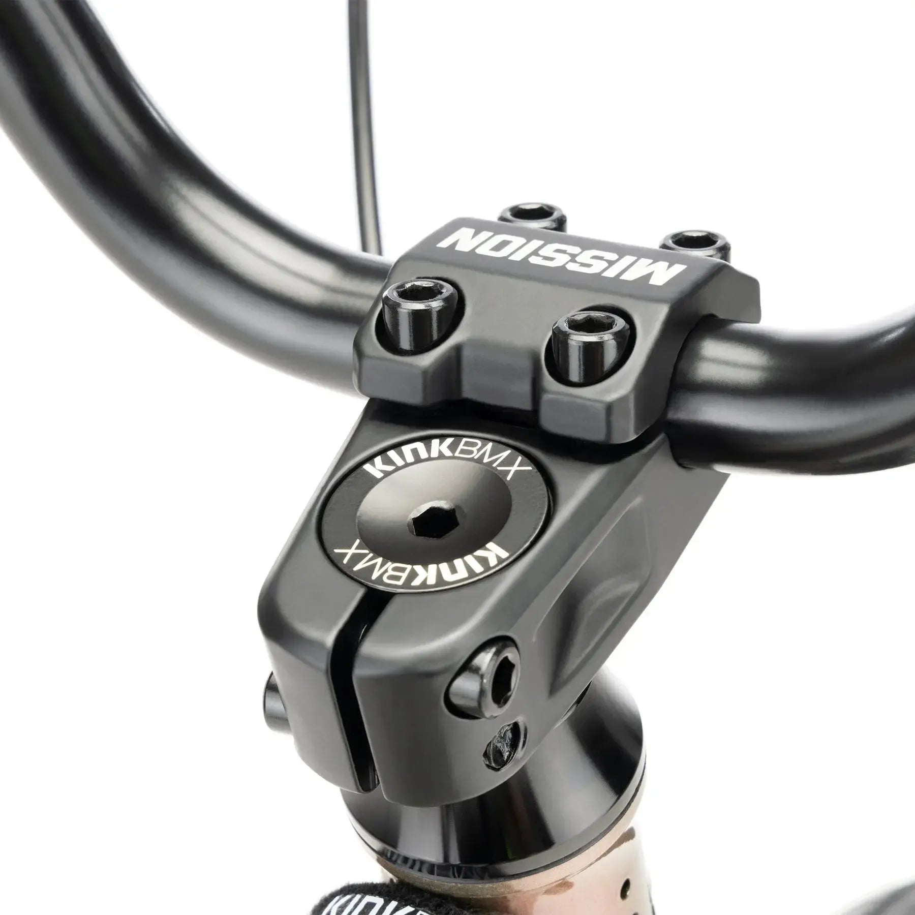 Close-up of the handlebar stem on a Kink Carve 16 Inch Bike (2026), featuring "MISSION" on the stem cap and "KINK BMX" on the bolt—ideal for kids starting their BMX journey.