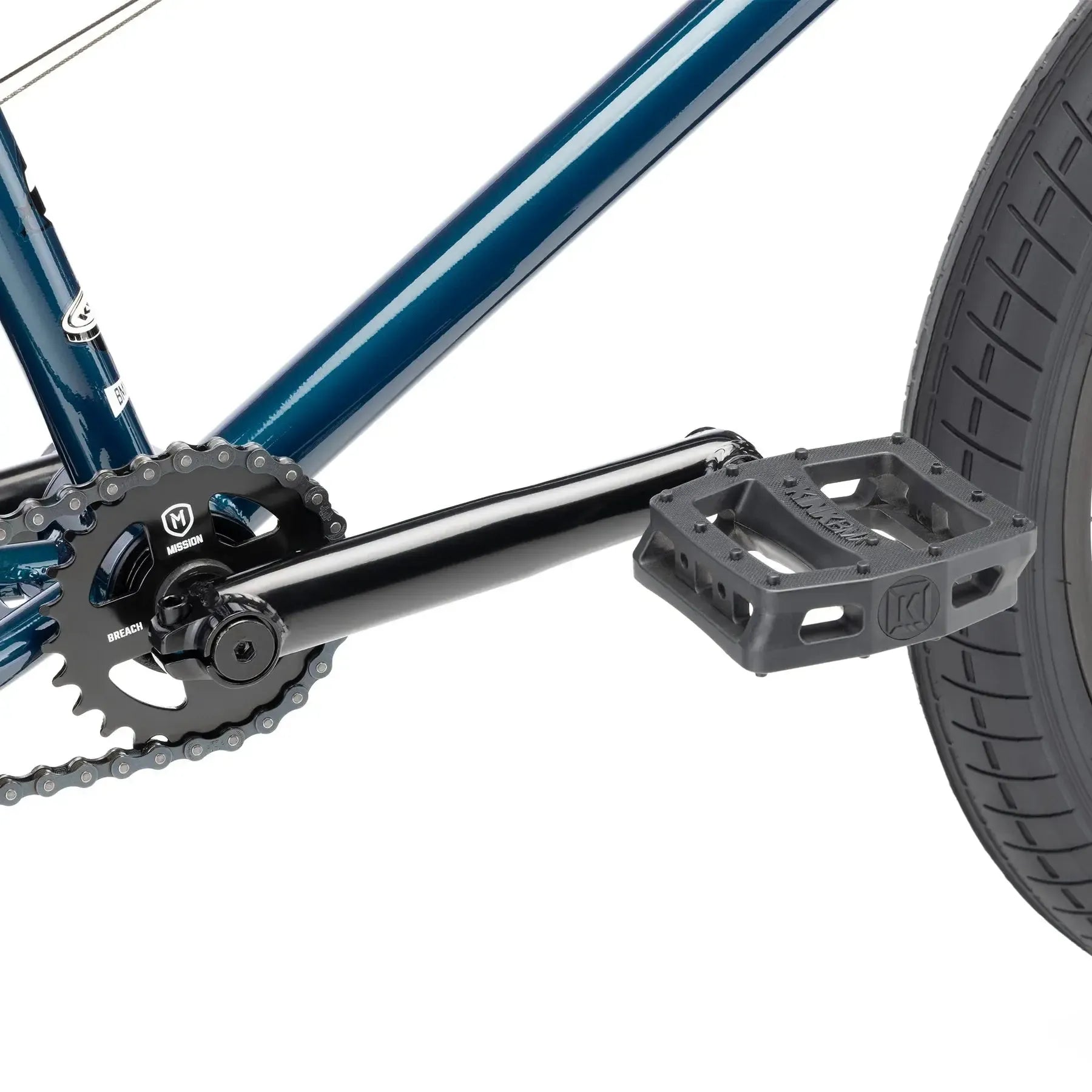 Close-up of the Kink Curb 20 Inch Bike (2026)'s pedal, crank arm, chainring, and rear wheel against a white background—ideal for those seeking a reliable entry-level BMX.