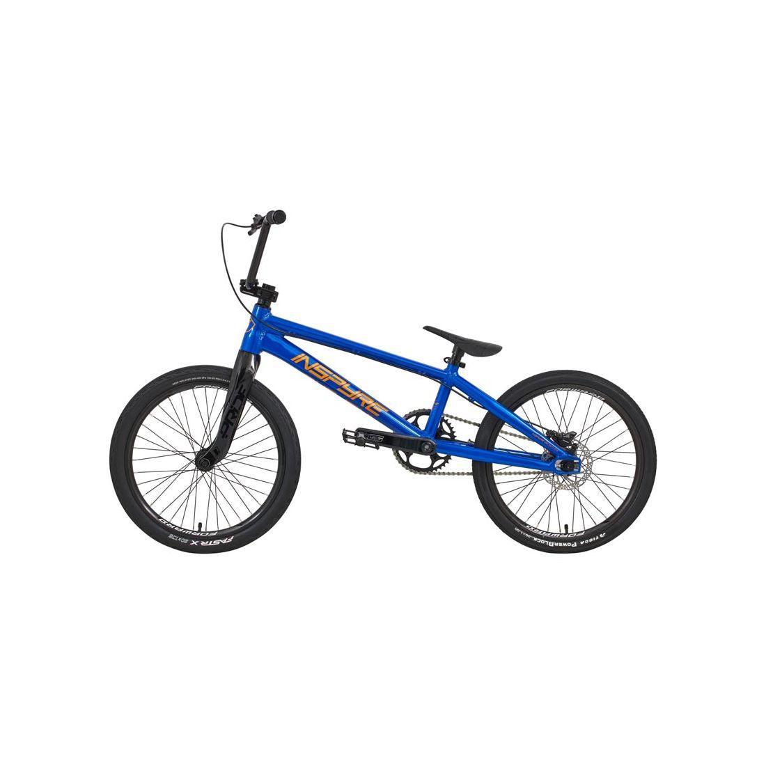 The Inspyre Evo-C Disc Pro L Bike 2026 is a blue BMX race bike with black tires, black handlebars, Shimano hydraulic disc brakes, and an orange "NSH" logo on the frame, shown against a white background.