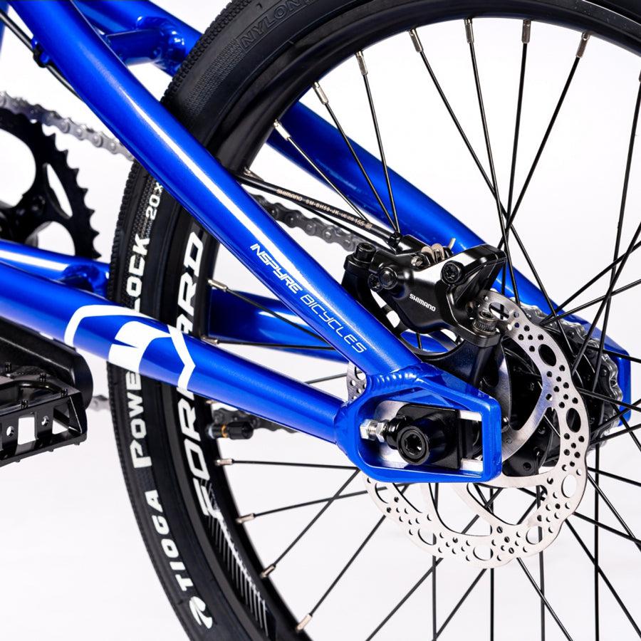 A close up of a blue Inspyre Evo Disc Junior Bike featuring a disc brake. The bike has a hydroformed 6061 aluminium frame from the brand Inspyre.