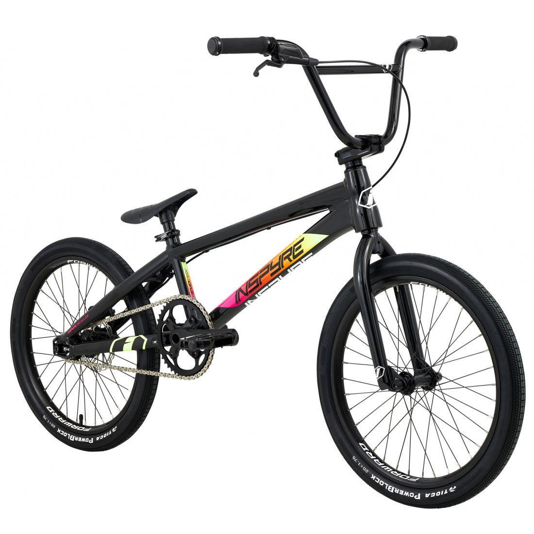 The Inspyre Evo Disc Pro L Bike 2026 is a black BMX race bike with rainbow accent graphics, thick tires, straight handlebars, and a single gear, shown from a slight front angle.