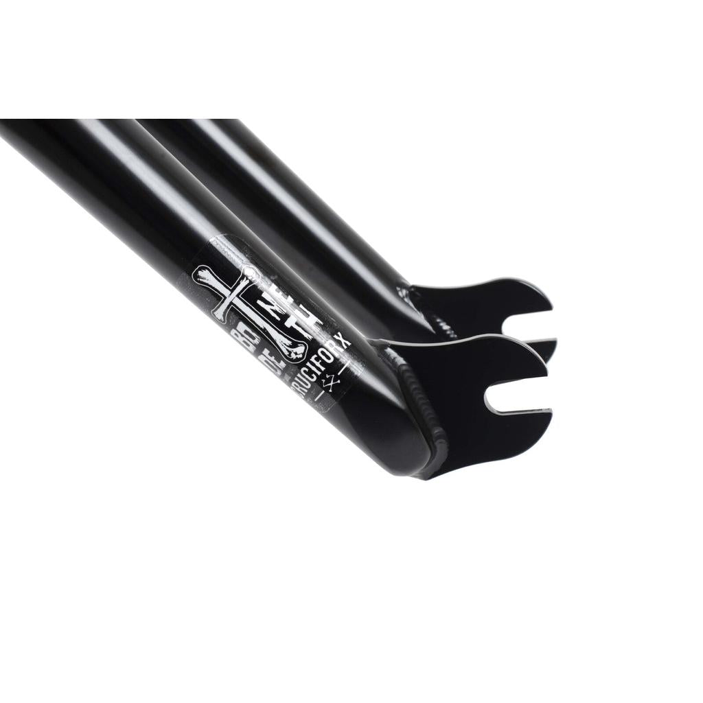 Close-up of a black Bone Deth Cruciforx fork, featuring a logo and 28mm offset with an open dropout design for easy front wheel attachment.