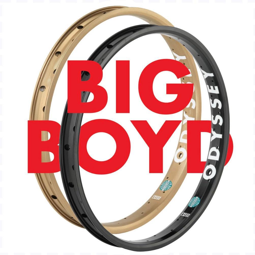 The Odyssey Big Boyd Rim comes in gold and black with bold "ODYSSEY" branding, featuring an extra-wide design ideal for street and park BMX riding. The rim is shown overlapped with large red "BIG BOYD" text across the center.