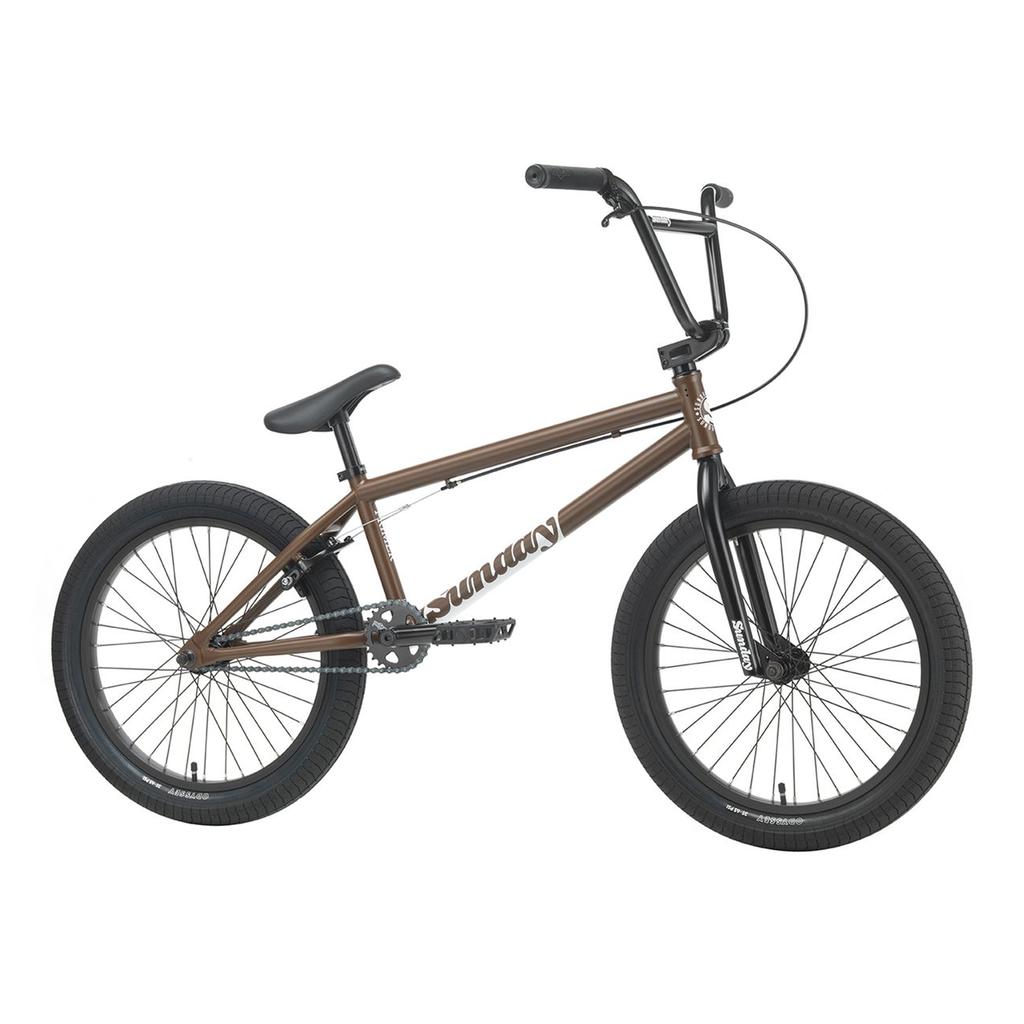 A brown Sunday Primer 20 Inch Bike with black handlebars, seat, tires, and pedals, shown from the side on a white background. Perfect for beginners, this BMX bike blends sleek style with practical design to support new riders.