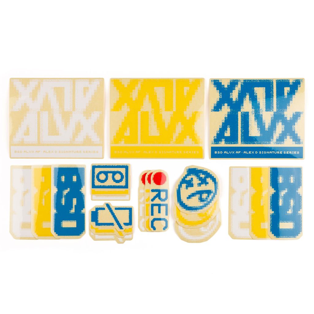 A collection of variously shaped and colored designs featuring abstract patterns and symbols, arranged in three rows, encased in a BSD ALVX AF Frame 2019 Decal Set. The items include squares, rectangles, and circles in blue, yellow, and white.