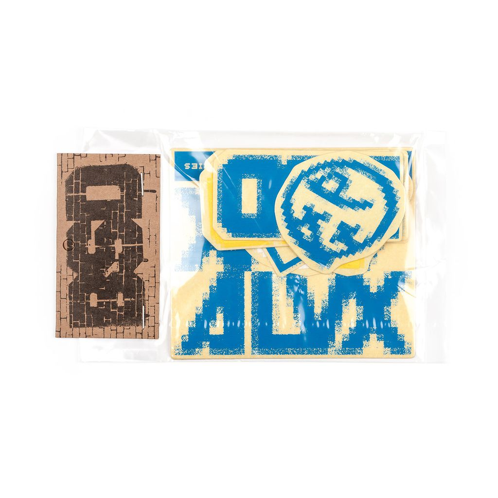 Assorted cardboard and foam cutouts in blue and yellow, packaged in a clear plastic bag, alongside a separate brown cardboard piece, perfect for BSD ALVX AF Frame 2019 Decal Set projects or replacement sticker packs.