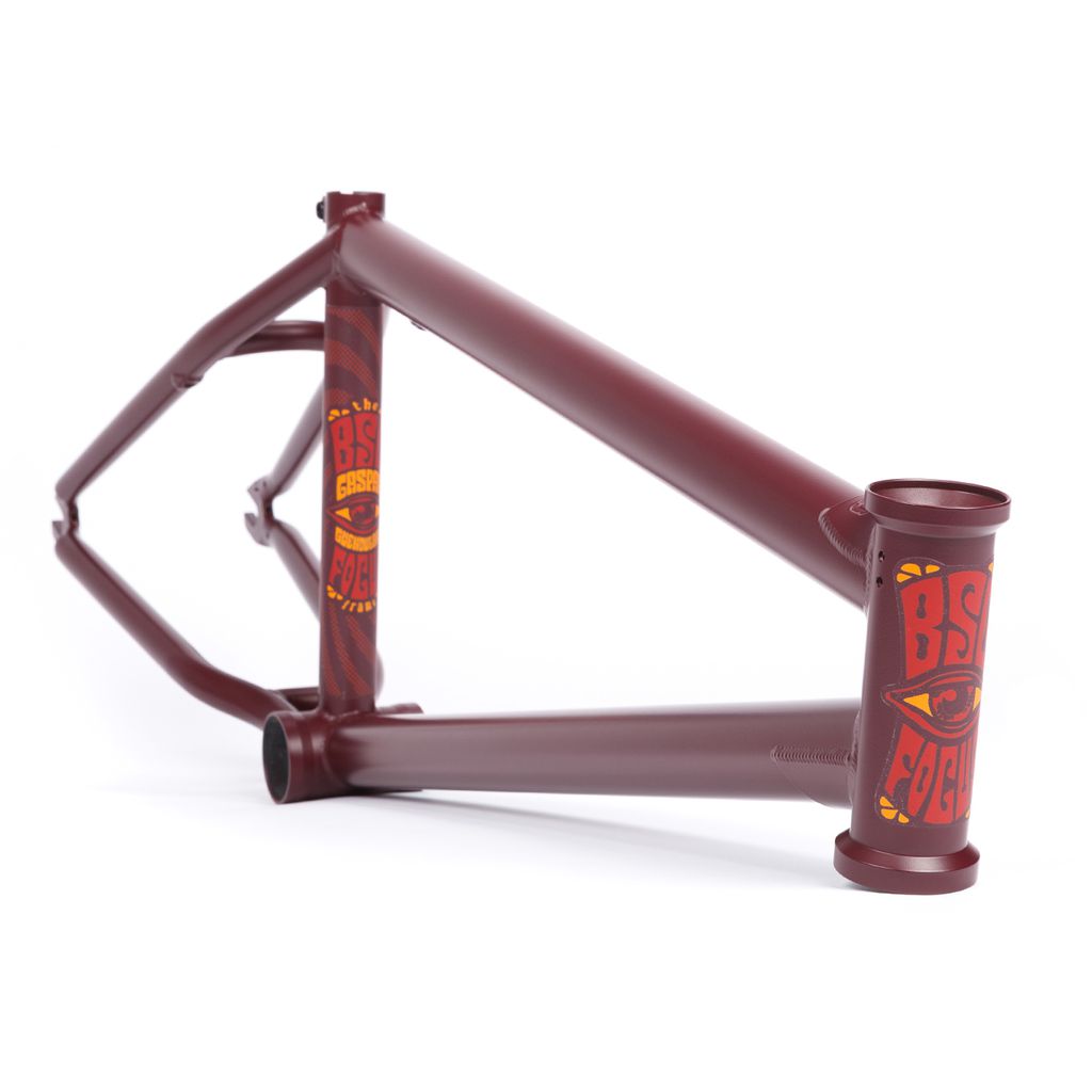 A maroon BSD Focus Frame (Gaspar Guendulain) BMX with yellow and red graphics on the head tube and seat tube, shown on a white background.