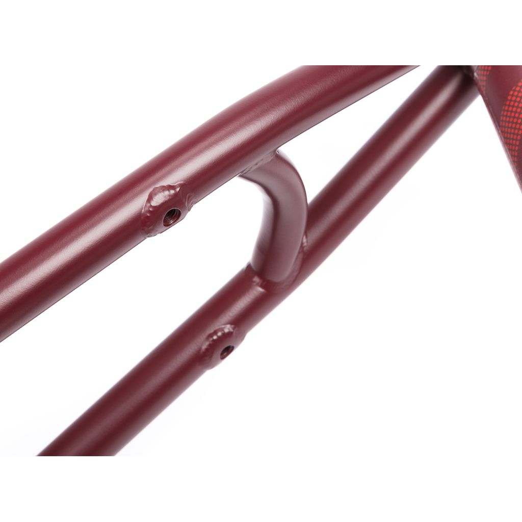Close-up of the BSD Focus Frame (Gaspar Guendulain) in maroon, showcasing its precision-welded joints and tube connections against a white background.