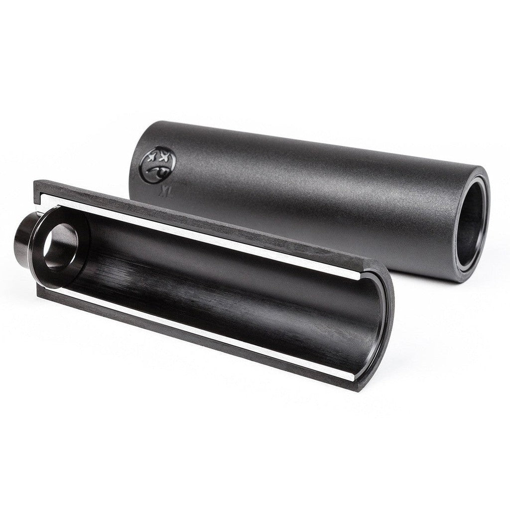 The BSD Rude Tube LT XL V2 Alloy/PC Peg (Each), designed with a black cylindrical shape and crafted from lightweight 7075 alloy, is cut in half to reveal a hollow interior.