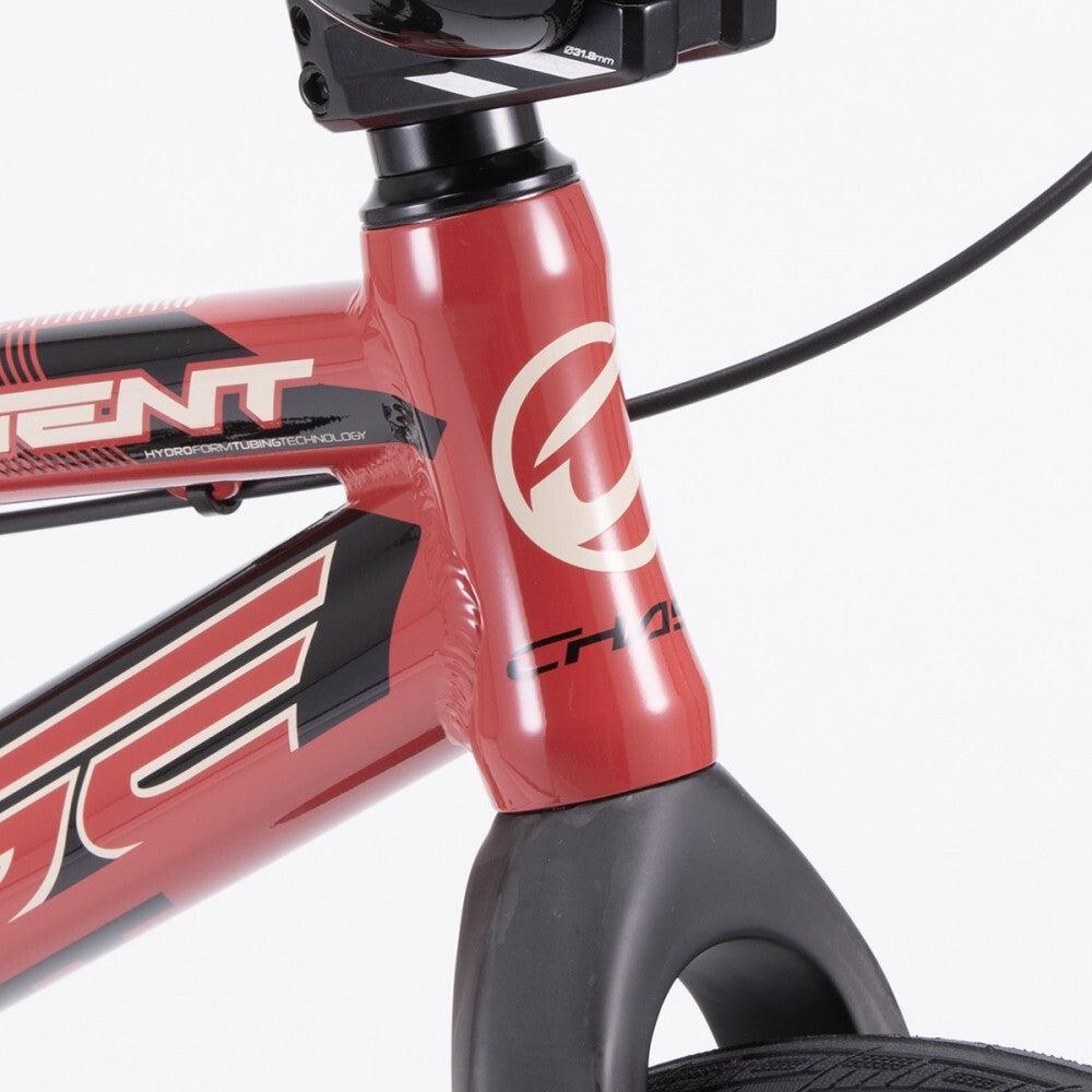Close-up of a red Chase Element Pro XXXL Bike *scratch and dent* front frame with Ikon carbon forks, partial handlebar, headset, and front tire, accented by black and white decals.