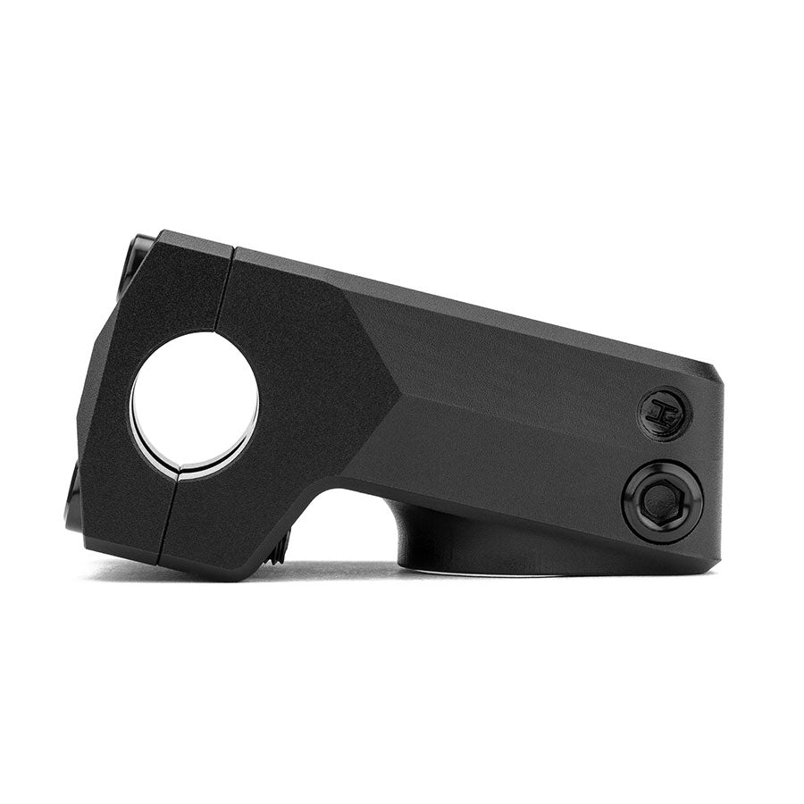 A black bicycle stem with a hexagonal design, featuring two bolts for secure attachment to handlebars. The Cinema Projector Stem appears to be made of metal and is designed for durability and performance.