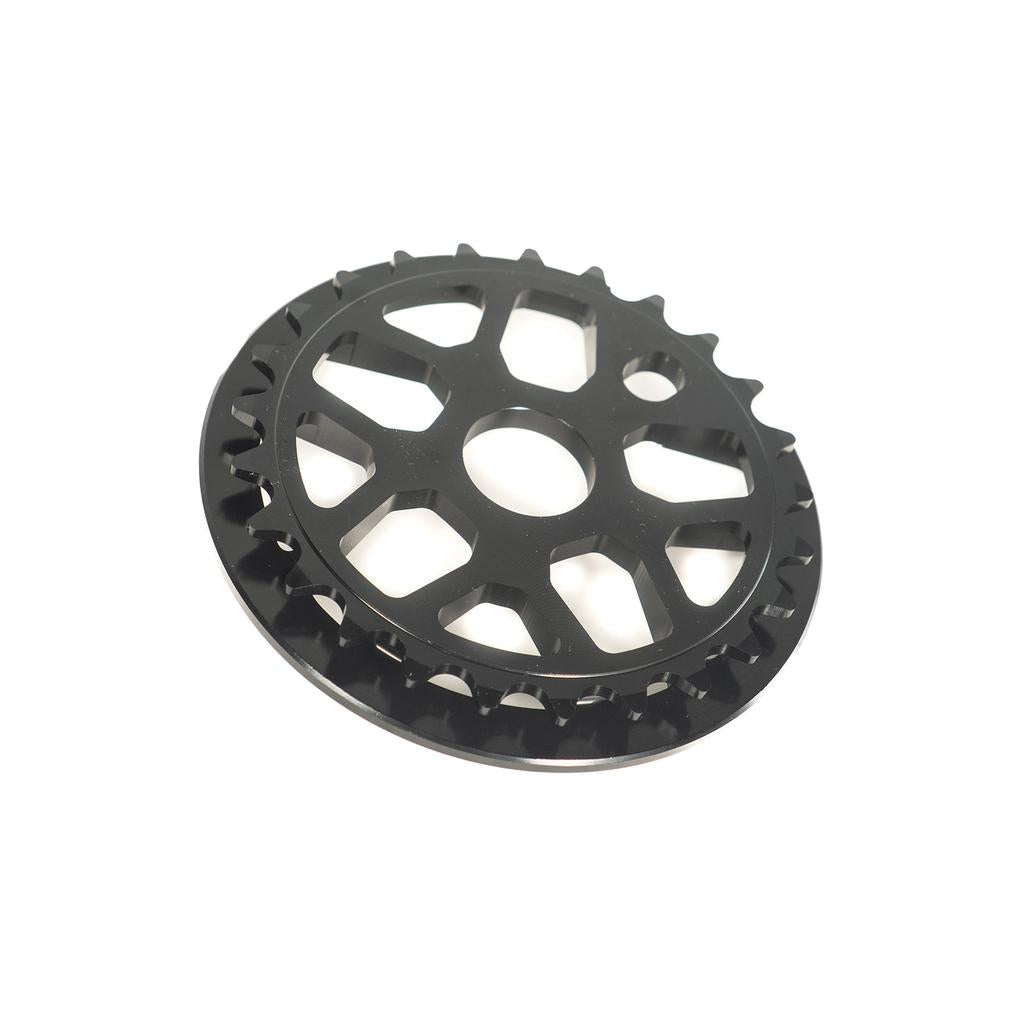 Colony Bish Guard Sprocket: A black BMX sprocket made from 7075-T6 aluminum, showcasing sharp teeth and a central hole on a white background.