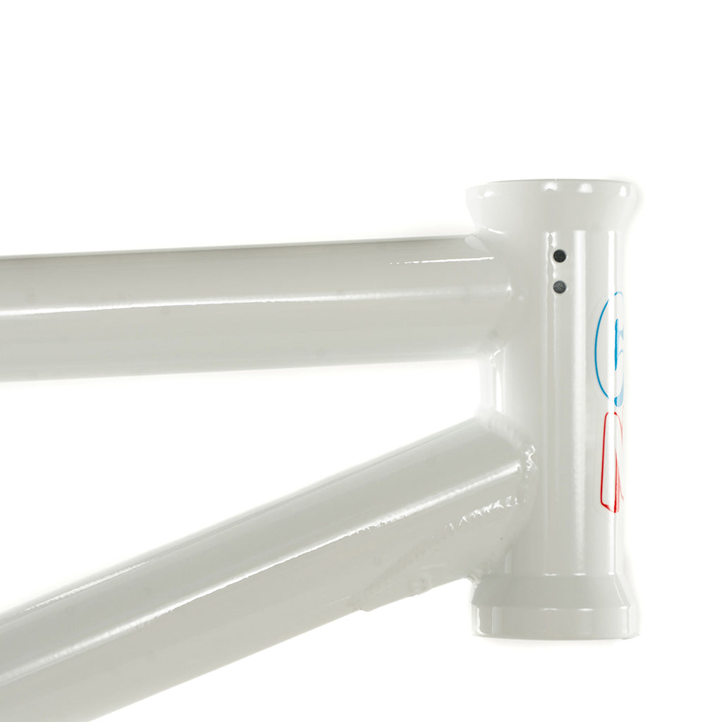 A white Colony Enishi Flatland frame with a blue logo on it, designed as Kio Hayakawa's signature model for flatland riders.