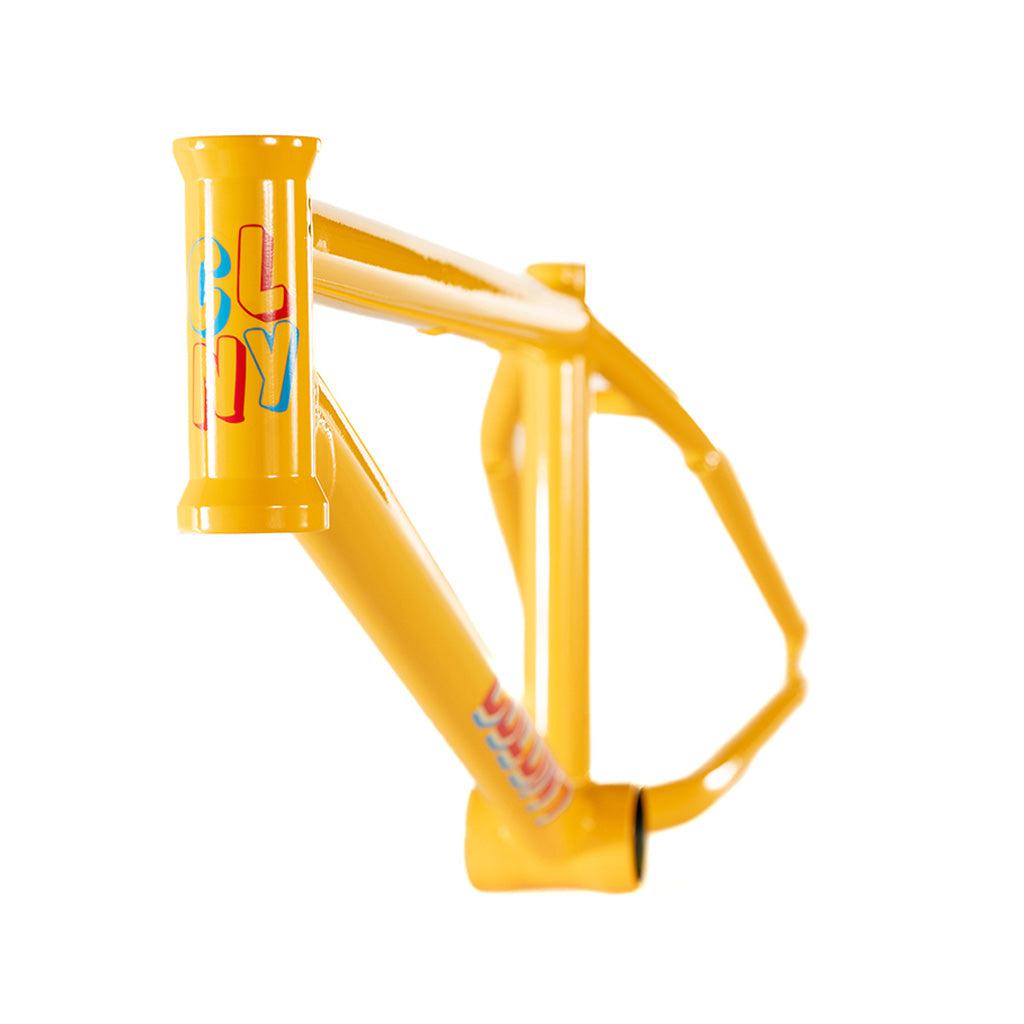 The Colony Enishi Flatland Frame (Kio Hayakawa Signature), features a vibrant yellow bicycle frame set against a sleek white background.