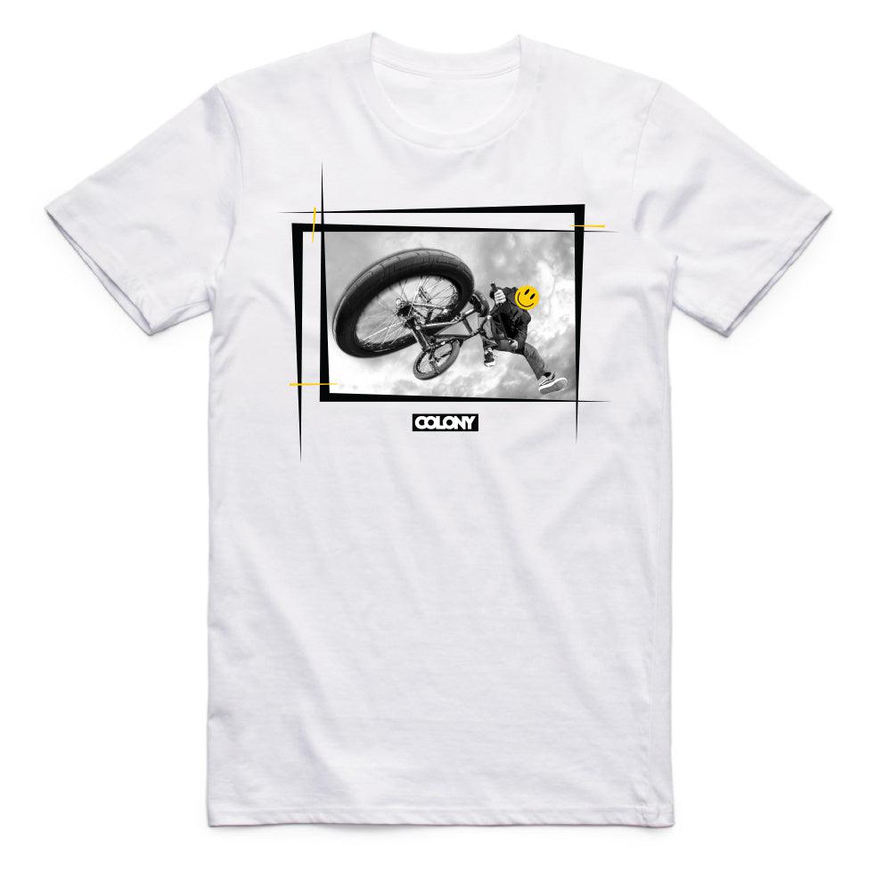 A Colony Happy Face T-Shirt featuring an image of a man riding a bike from Colony BMX.