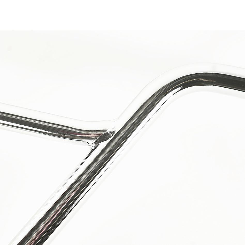 A close-up of intersecting chrome-plated metal pipes, resembling the sleek design of Colony Hardy V2 Bars, against a white background. The scene highlights their shiny, reflective surfaces and angular joins reminiscent of precise D shape handlebar craftsmanship.