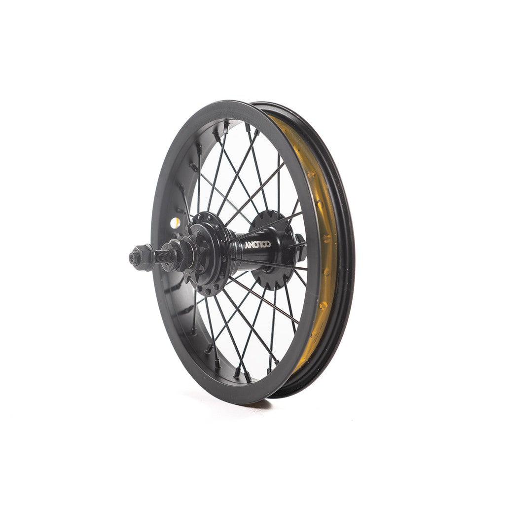 A Colony Horizon 12 Inch Rear Wheel in black, featuring reflective accents and a hub, photographed at an angle against a white background.