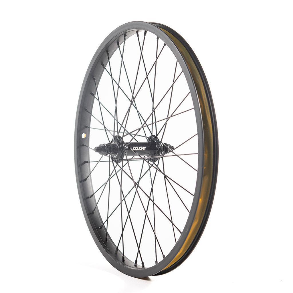 The Colony Horizon 20 Inch Front Wheel, with its sleek alloy rim and black spokes, stands upright against a plain white background. The branding on the hub adds elegance to this finely crafted component.