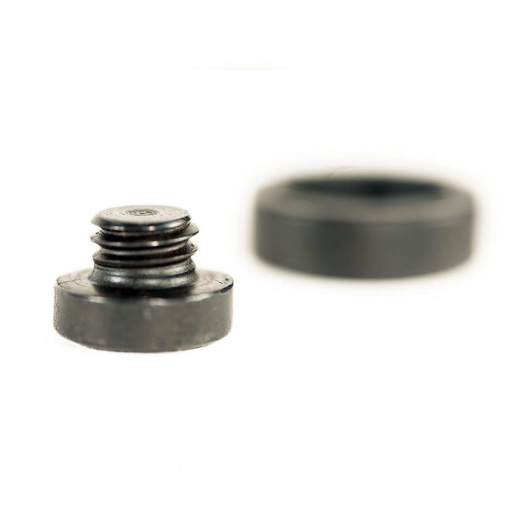 A lightweight Colony Oneway CrMo Peg and nut on a white surface.