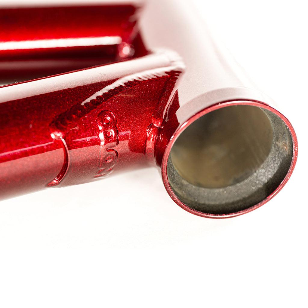 A close up of the Colony Rico 'Lite' Frame, a red bicycle frame designed by Paterico Fallico, the technical wizard.