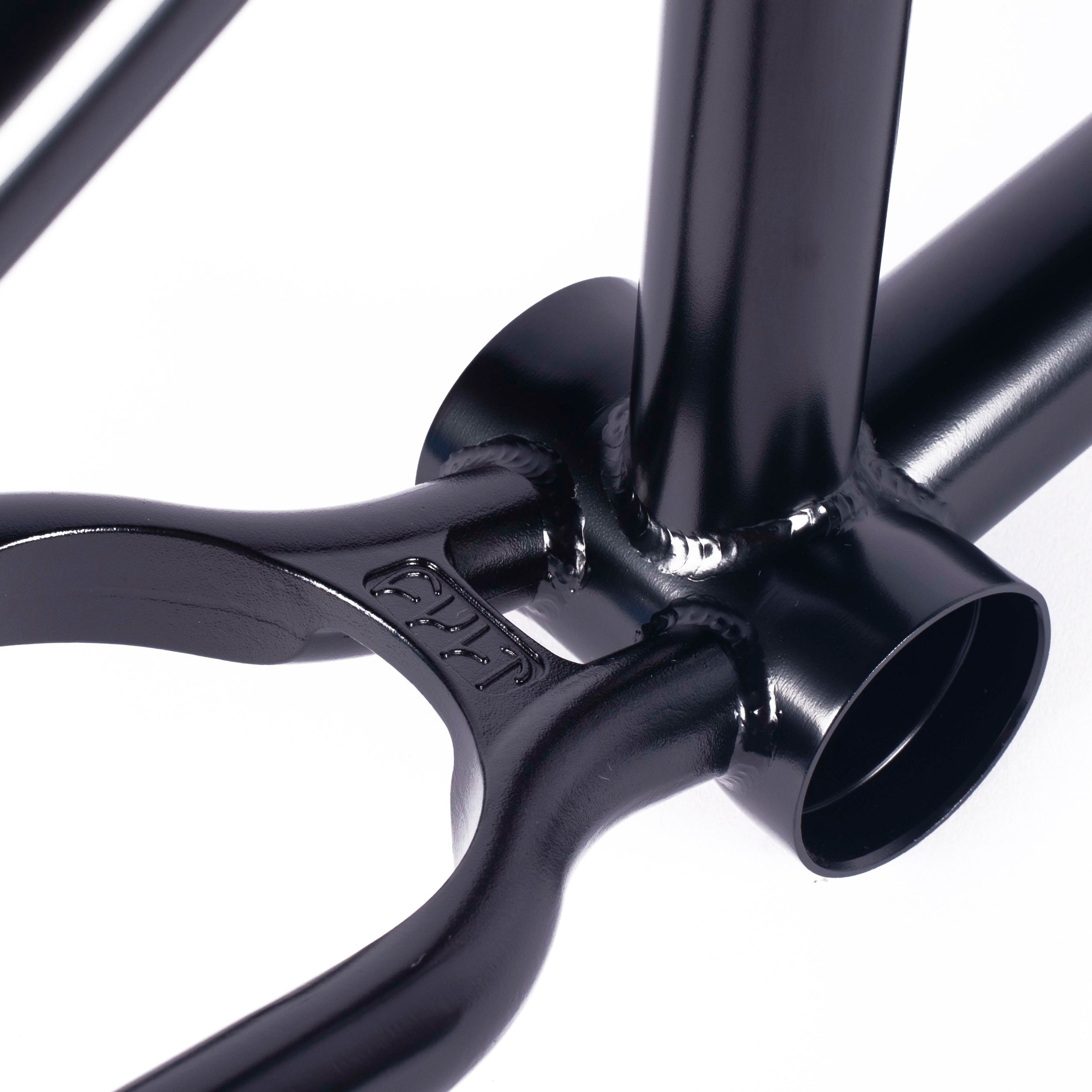 A black metal object with a hole, reminiscent of the Cult Biggie Frame (Devon Smilie Signature)'s street geometry.