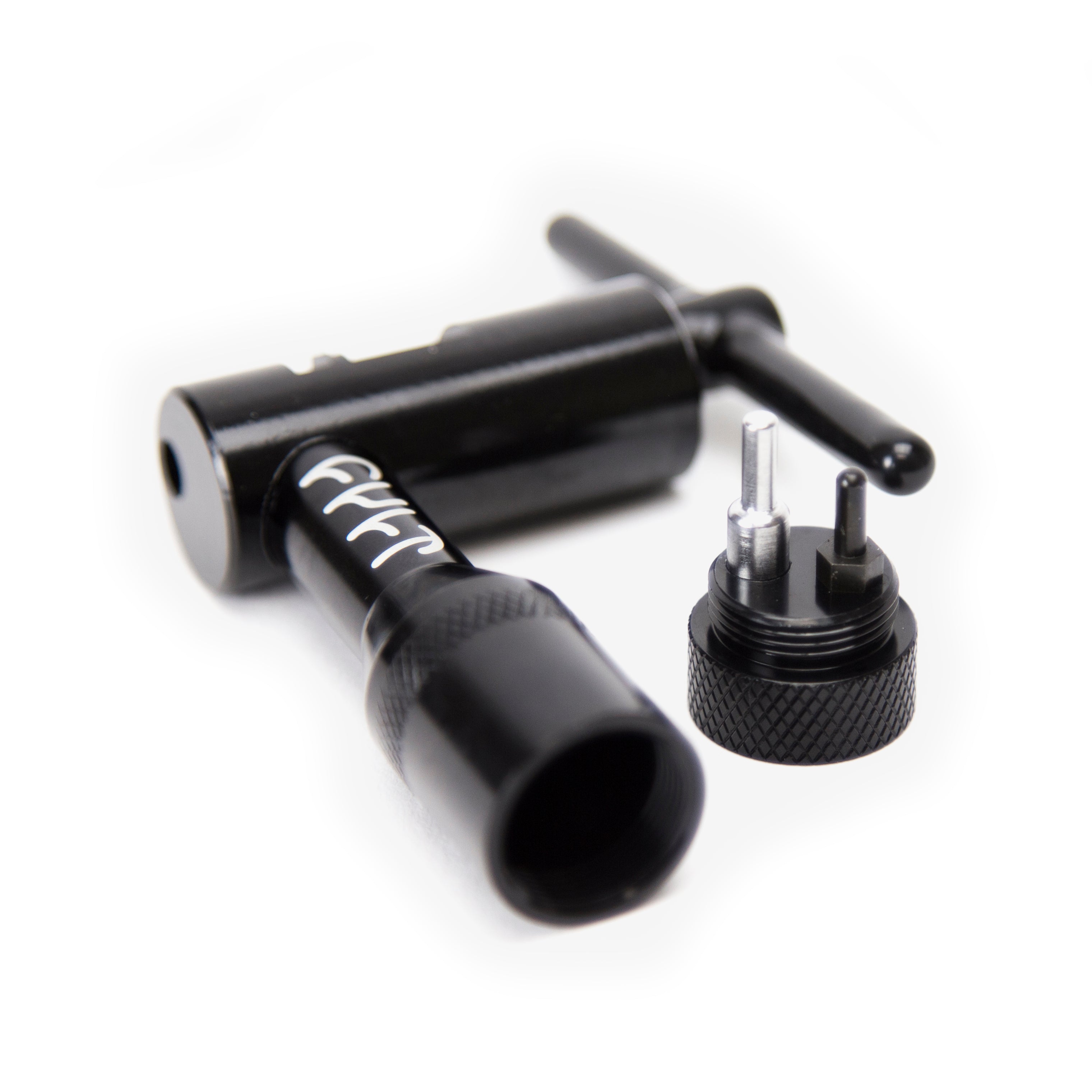 A Cult Chain Breaker tattoo machine with a CNC machined body and a detachable adjustable needle mechanism placed beside it.