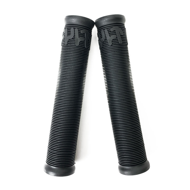 Adjacent on a white background are two durable rubber black Cult Crew Grips with a ribbed design.