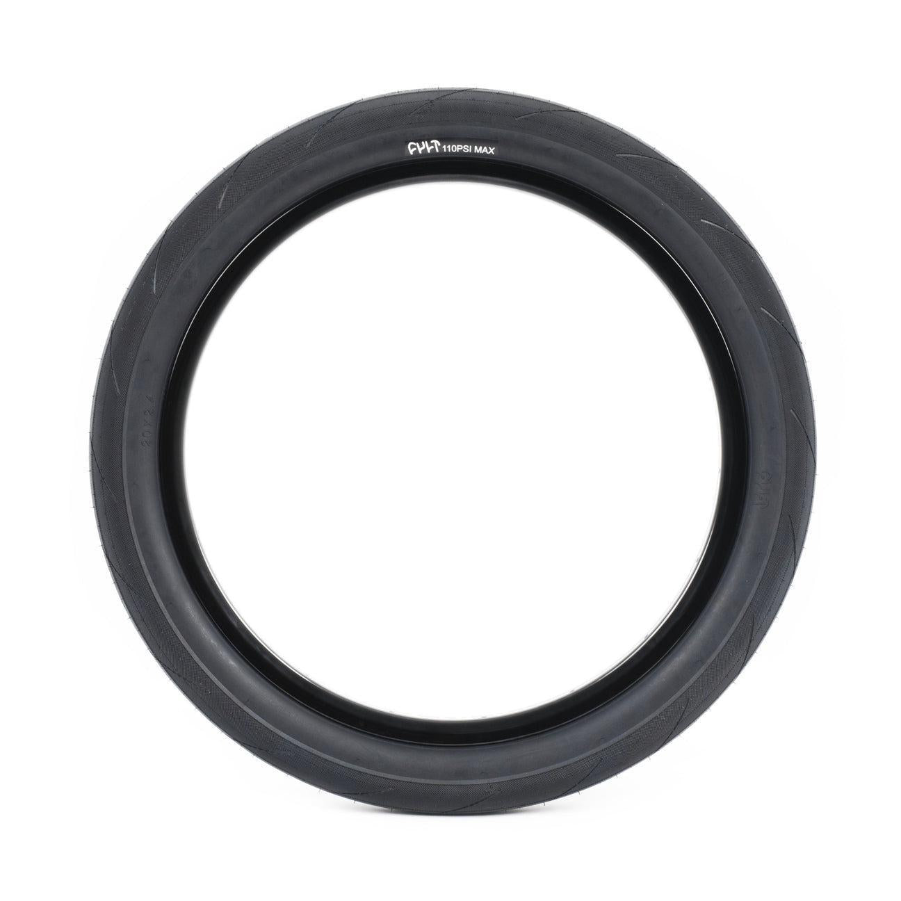The Cult Fast And Loose Folding Tyre, a black, round bicycle tire with minimal tread, is shown upright against a white background, designed for low rolling resistance and optimal speed.