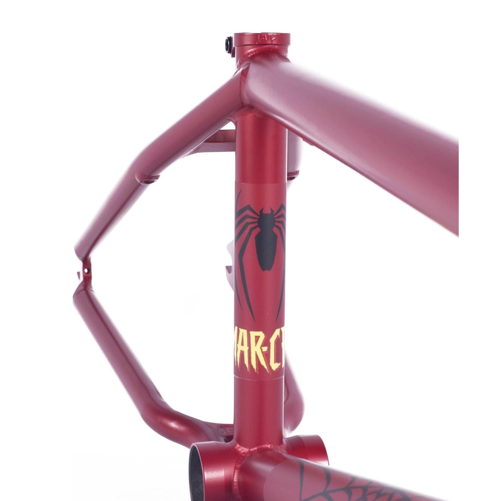 Close-up of a red BMX frame adorned with Spiderman graphics, featuring a spider decal and the word "WAR-CR" in yellow, reminiscent of the Cult Heavens Gate Frame (Marcel Anderson Colourway).
