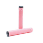Two Cult Solo Grips in pink and white stripes—one upright, one horizontal—are displayed on a plain white background. Inspired by Sean Ricany, these grips feature a cylindrical BMX design.