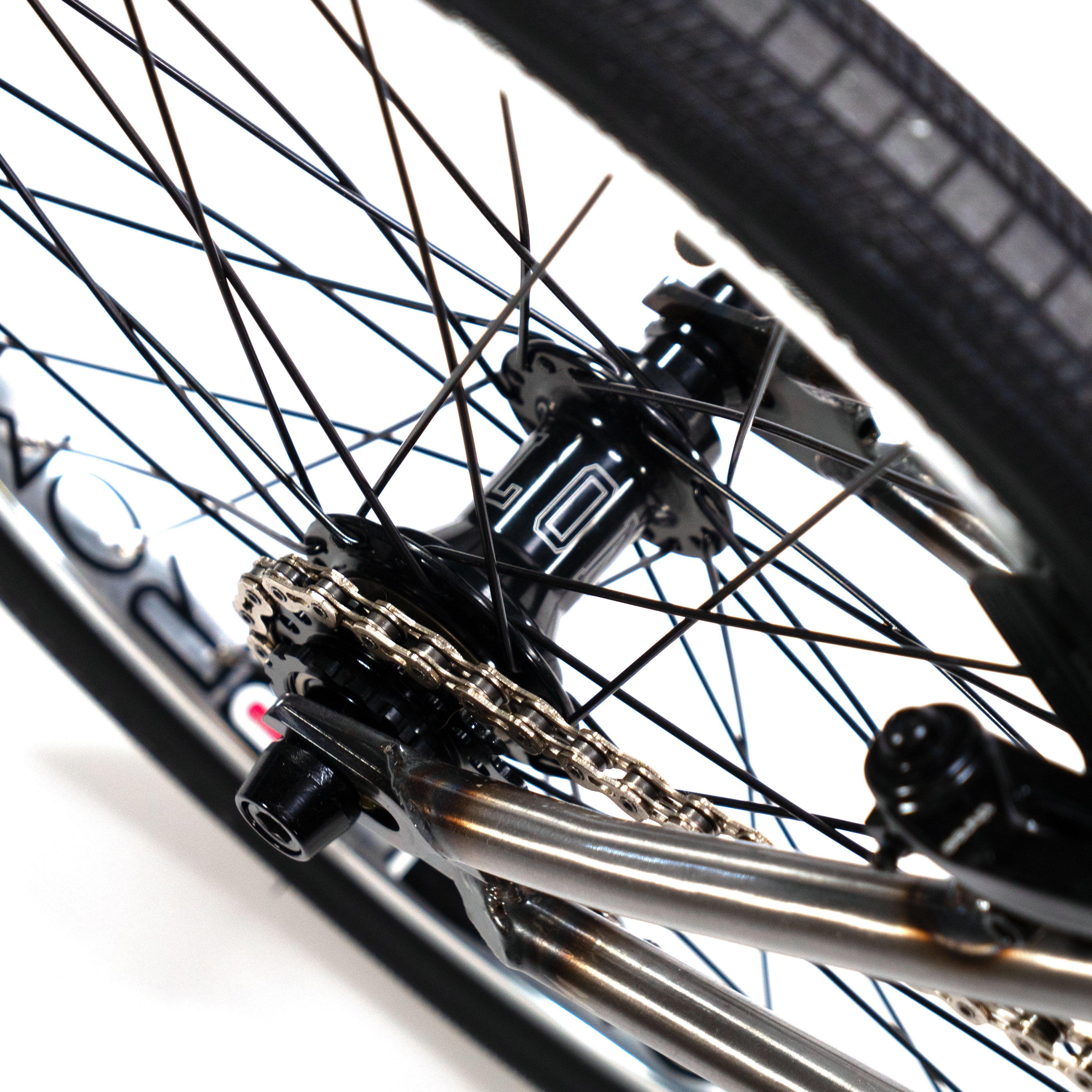 A high-performance Cult Vick Behm Custom Race Bike with a race frame, featuring a close-up of the chain.