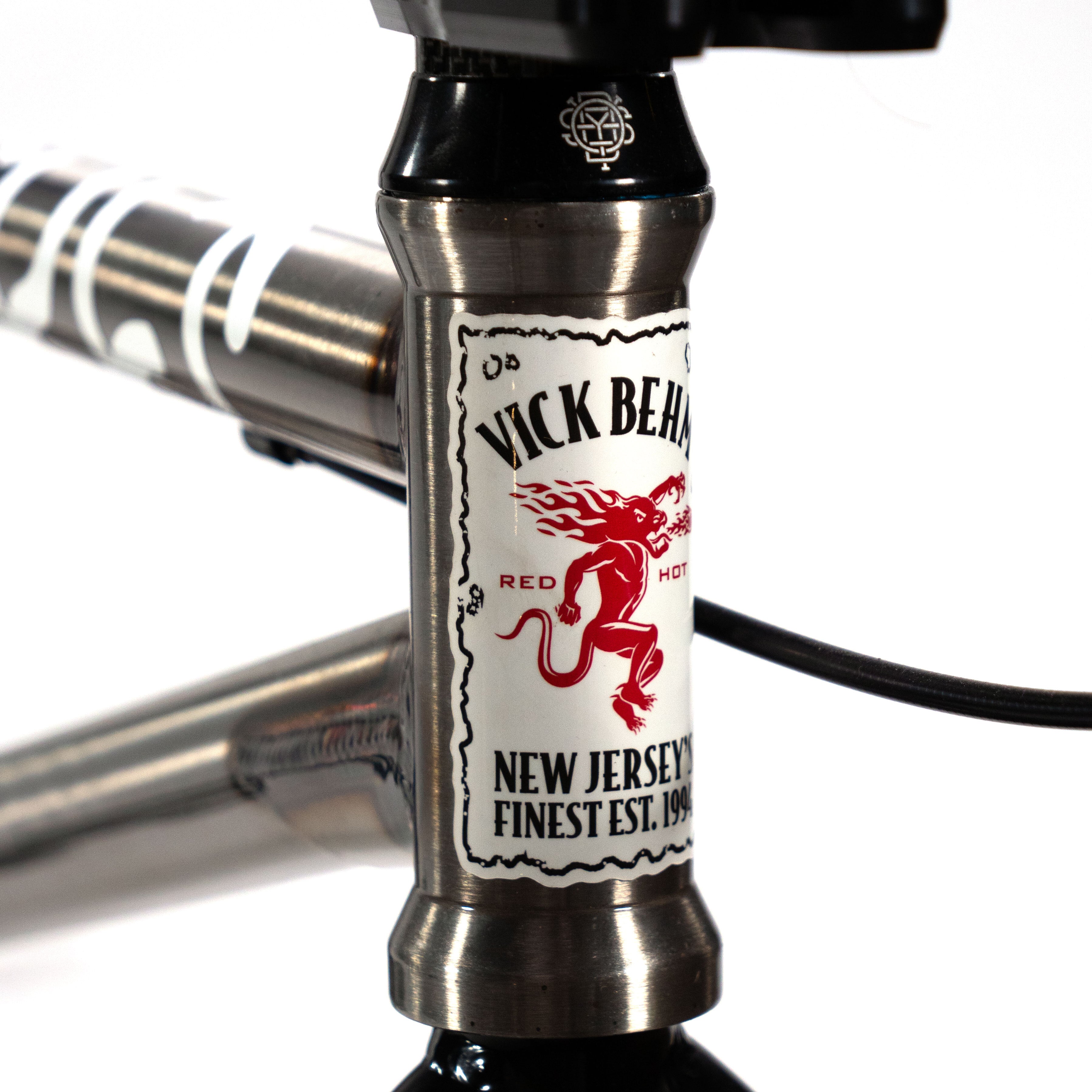 A close up of a Cult Vick Behm Custom Race Bike with a label on it.