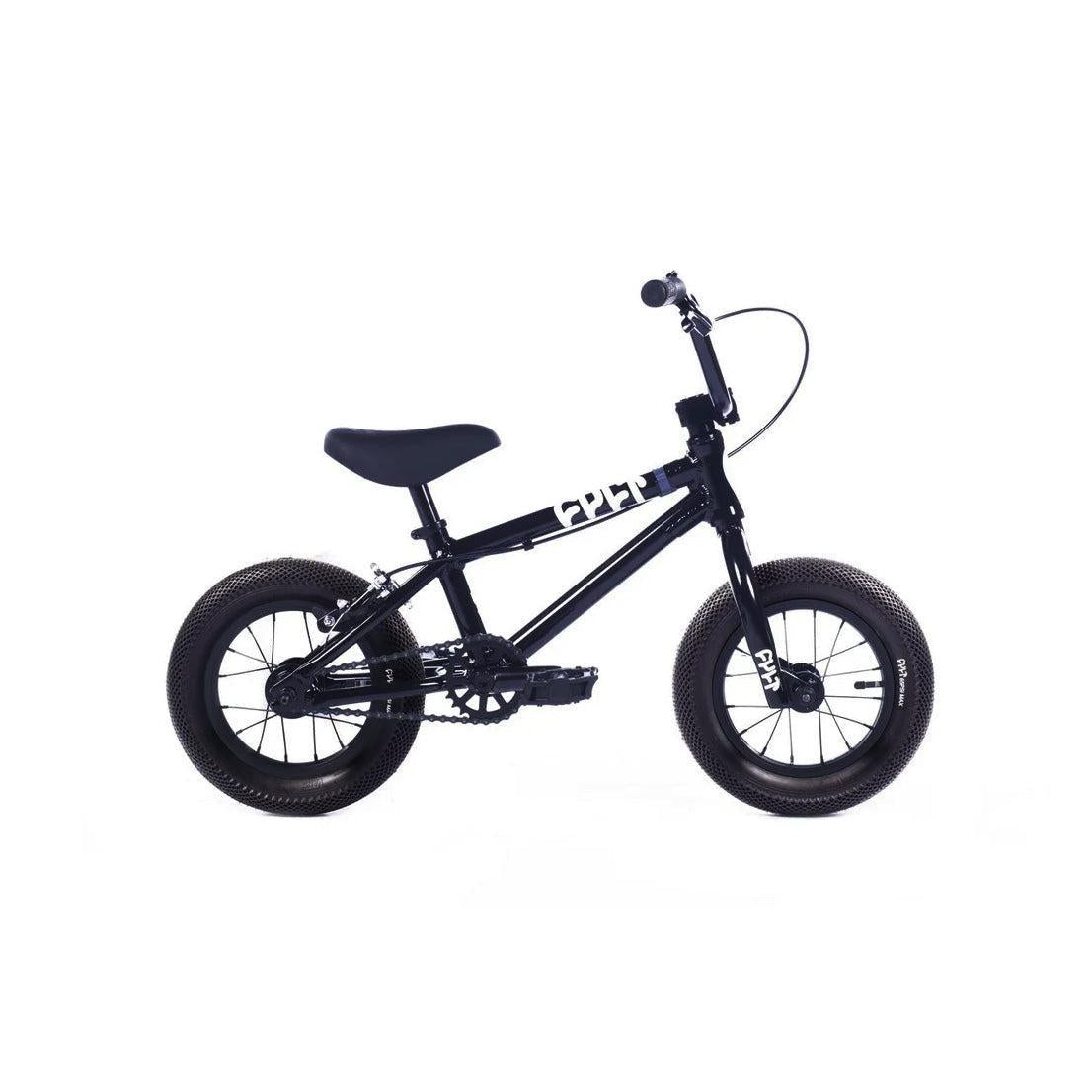 Cult Juvi 12 Inch Bike: small black kids BMX with thick tires, aluminum frame, black seat, and straight handlebars, shown side-on against a white background.
