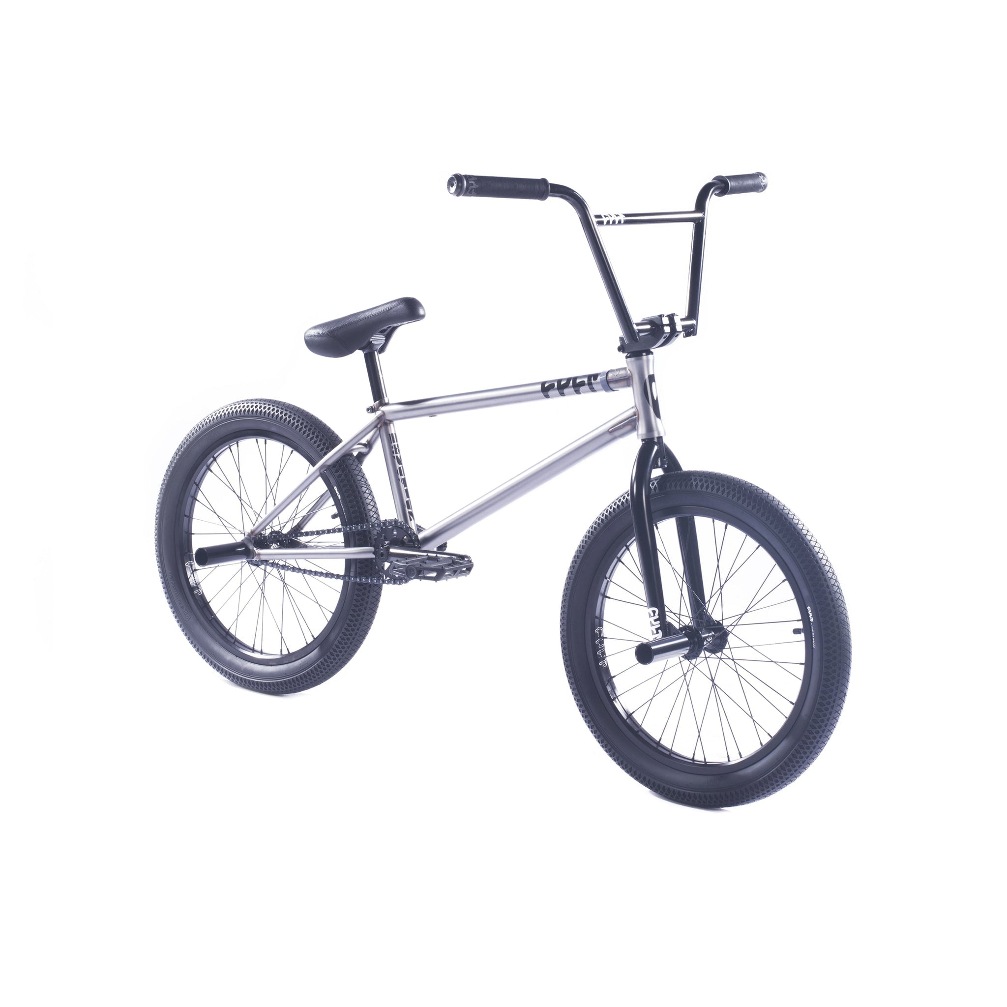 The Cult Devotion 20 Inch Bike is a premium BMX with a silver frame, black handlebars, seat, and tires, shown against a white background.