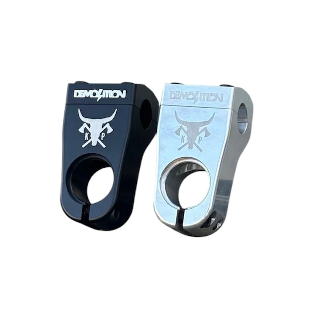 The Demolition Kevin Peraza Front Load Stem is available in black and silver, featuring the "Demolition" logo with a bull design, offering durability and embodying BMX bike mastery.