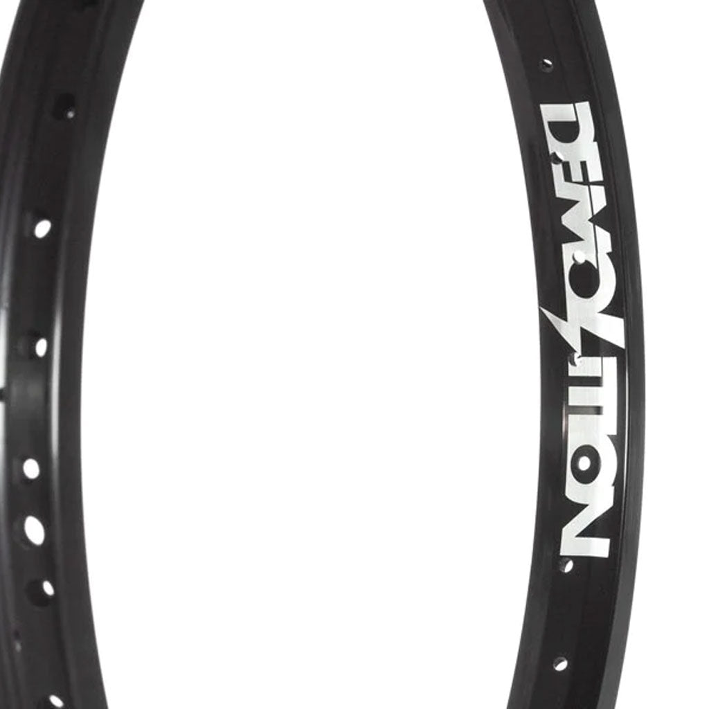 Mountain bike wheel rim with Demolition Zero Rim branding, featuring lightweight construction.