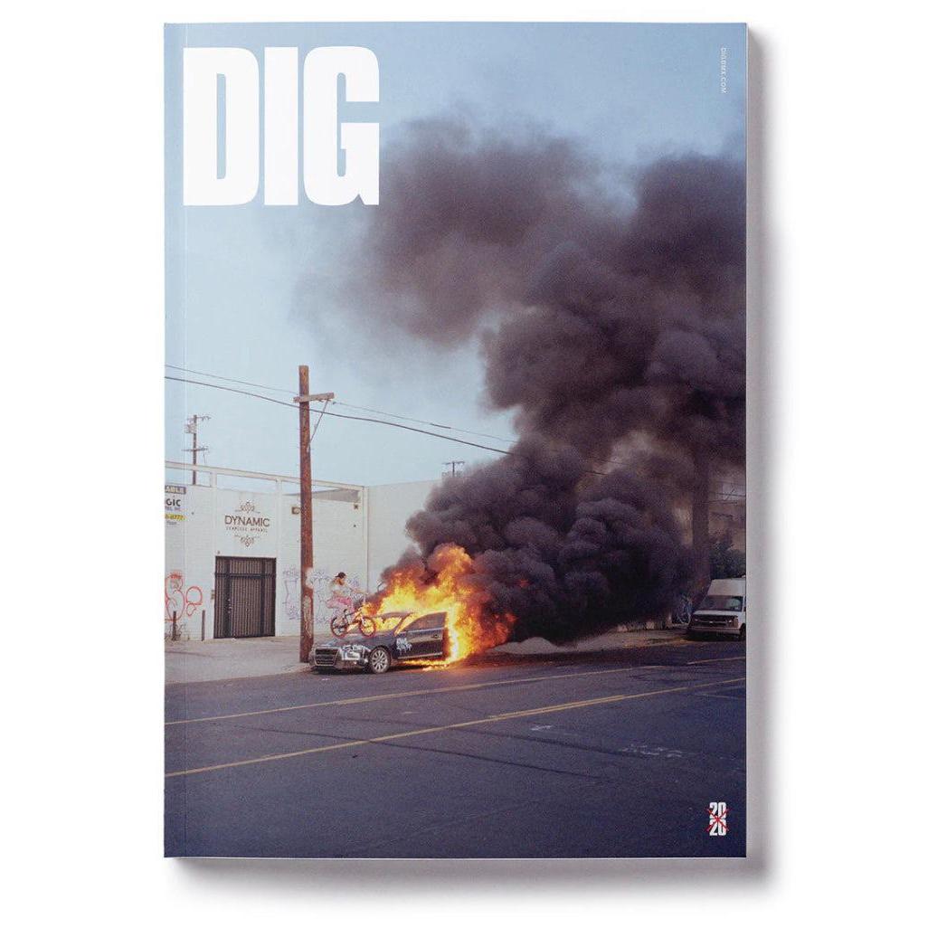 The explosive cover of DIG Book 2020 - Photo Annual showcases a blazing car, leaving viewers captivated by the daring image.