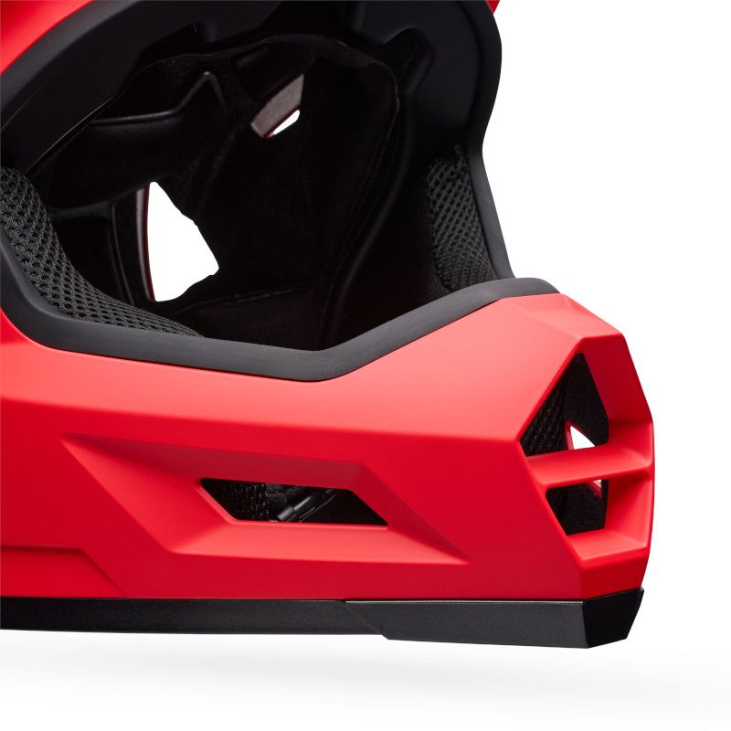Close-up of the Bell Sanction 2 Red helmet’s lower front, highlighting the chin guard, vents, and interior padding—perfect as an entry-level option for riders wanting solid protection.