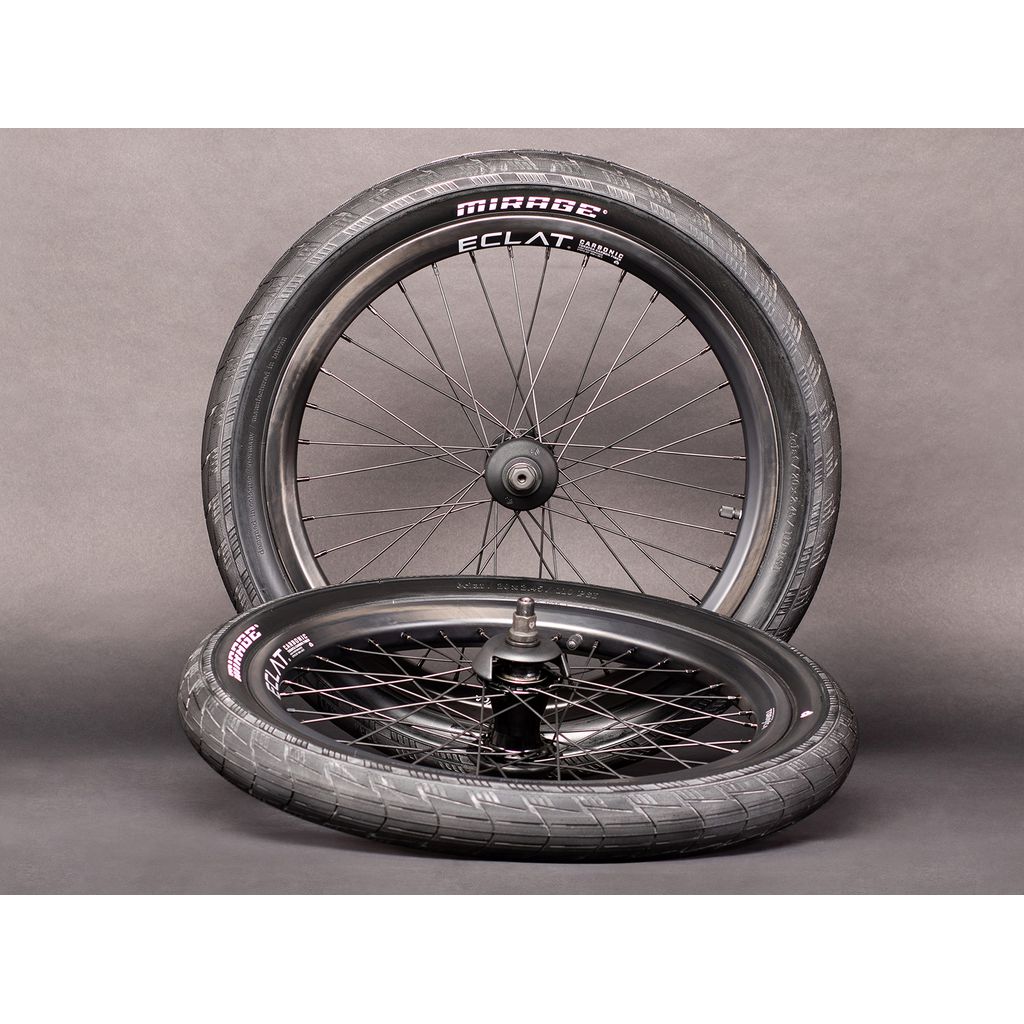 A lightweight Eclat Carbonic Rim (Braking Surface) bicycle wheel and tire on a gray background.