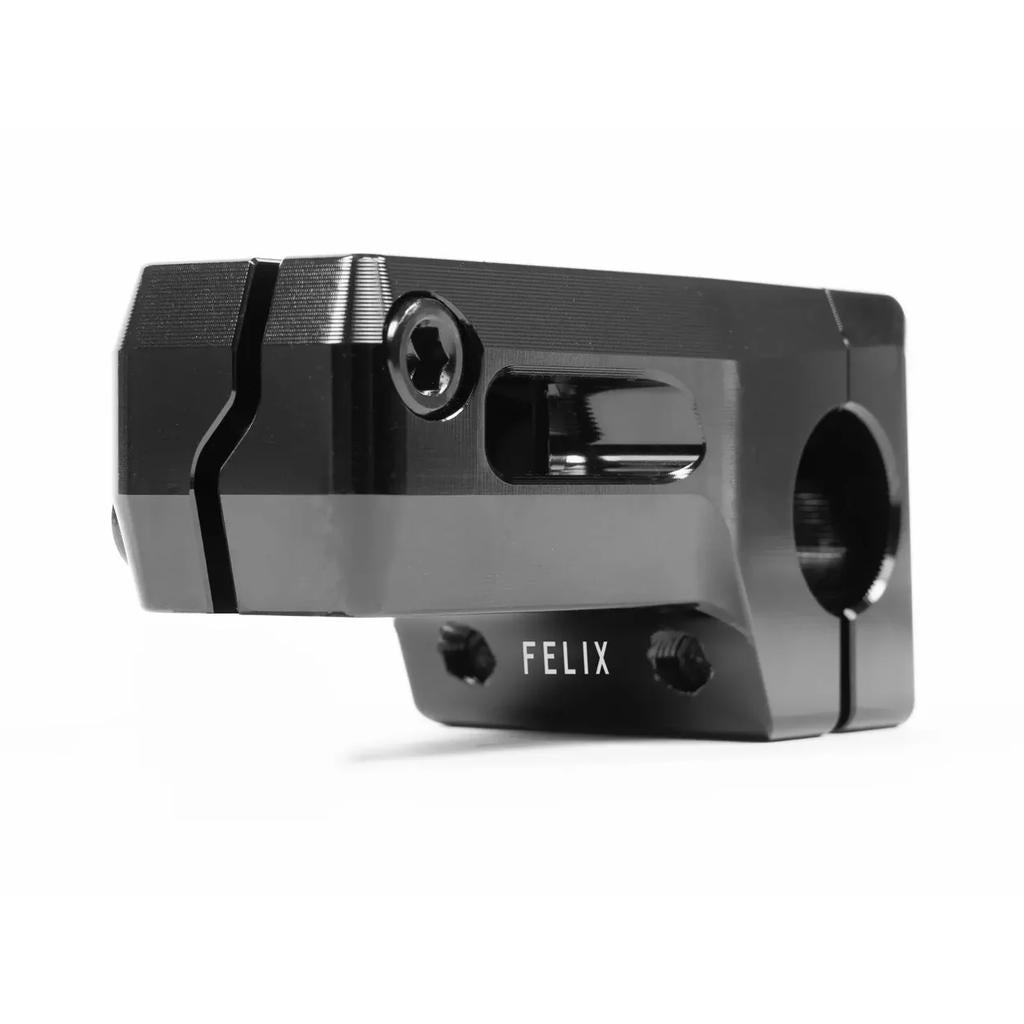 The Eclat Felix Front Load Stem, a black metal BMX piece designed by Felix Prangenberg, features "FELIX" engraved. It's CNC machined for precision with a Vice-Jaw clamping system for secure fastening, all in a sleek design.