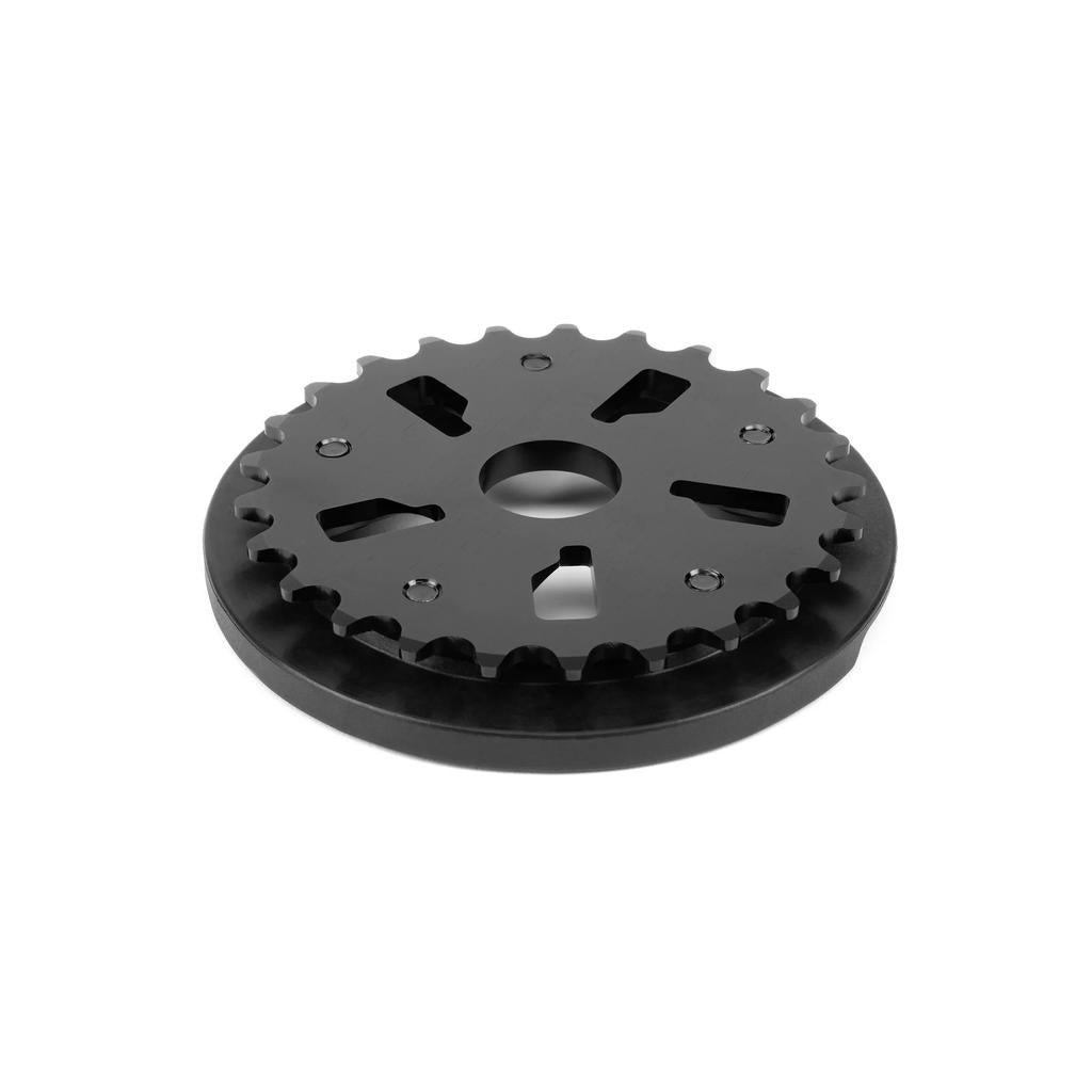 A black, round metal cogwheel with jagged teeth and five openings is displayed against a plain white background, showcasing the distinctive design of the Eclat Felix Guard Sprocket.