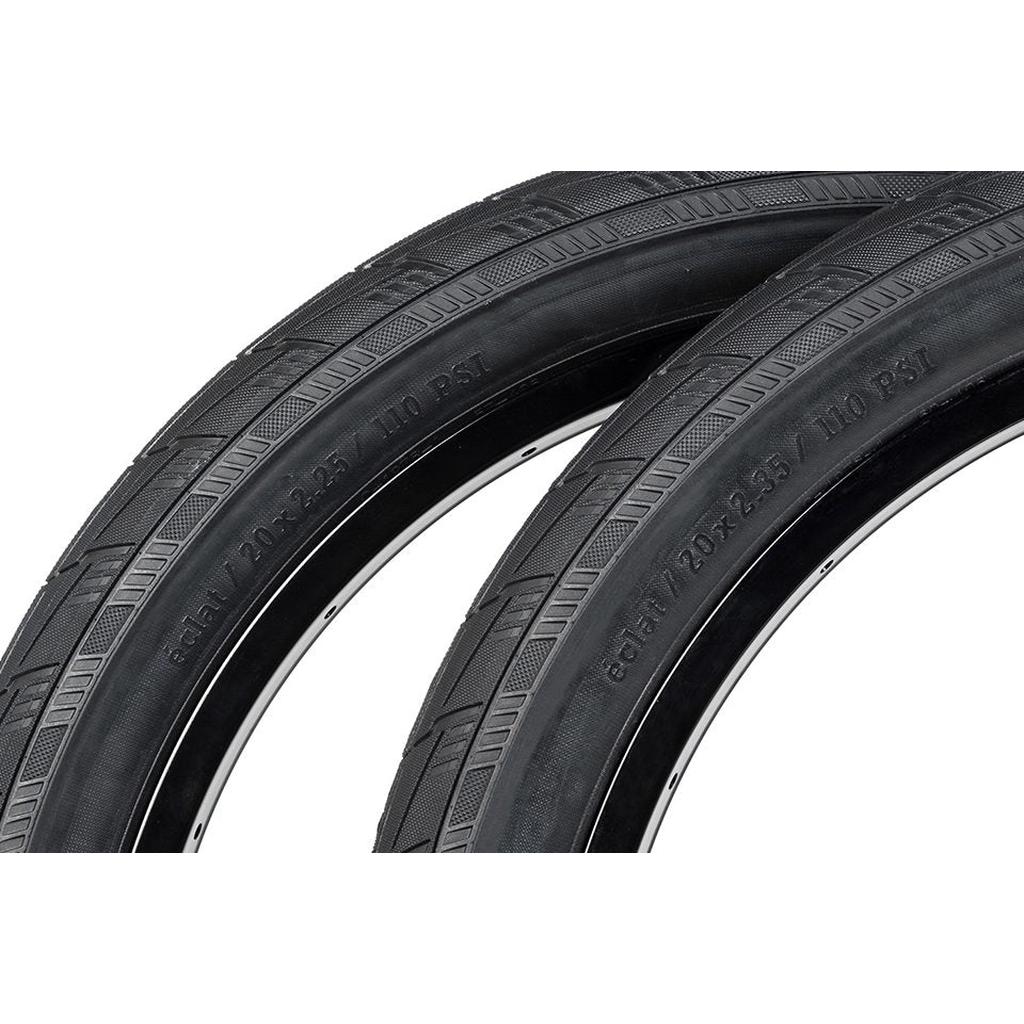 Close-up of two Eclat Mirage Folding Tyres, showcasing visible tread patterns and size markings with high-performance 120tpi casing in black.