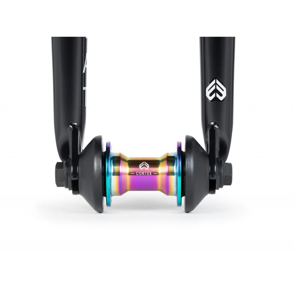 Close-up of a black scooter fork showcasing a vibrant, metallic centerpiece labeled "Cortex," akin to the robust design of the Eclat Storm Fork.